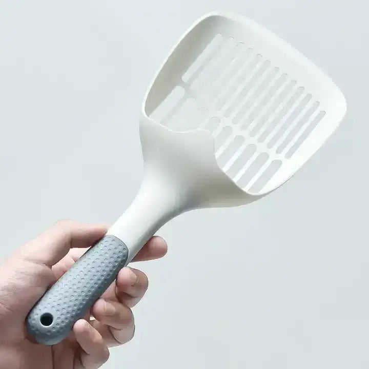 Pala arenero para gato XL de 30 cm con mango antideslizante sobre fondo neutro